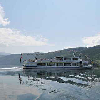 A tourist boat sailing on Lake Millstatt