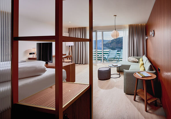 View into the bedroom with balcony and sofa