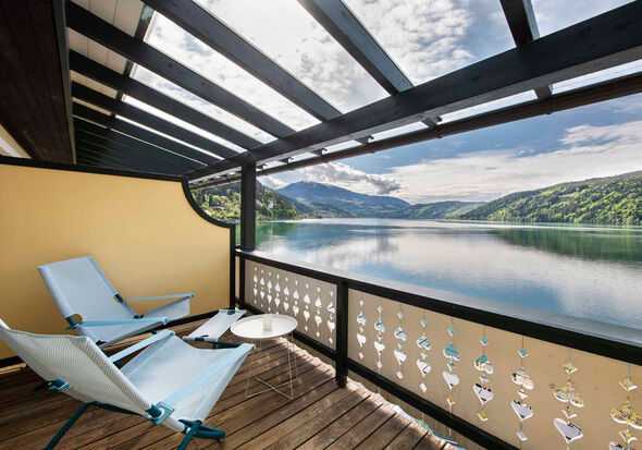 View of the lake from the balcony with 2 deckchairs