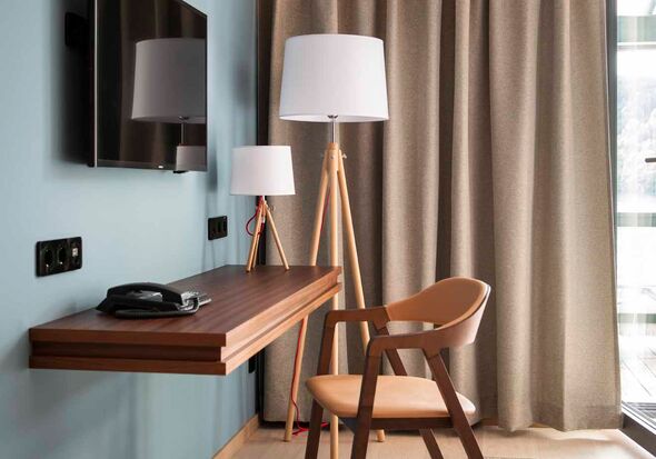 Chair with desk against the wall