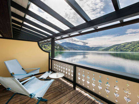 View of the lake from the balcony with 2 deckchairs