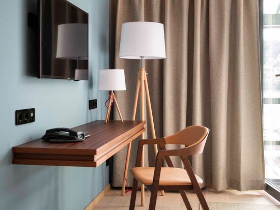 Chair with desk against the wall