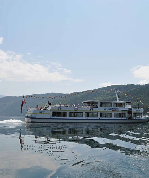 A tourist boat sailing on Lake Millstatt