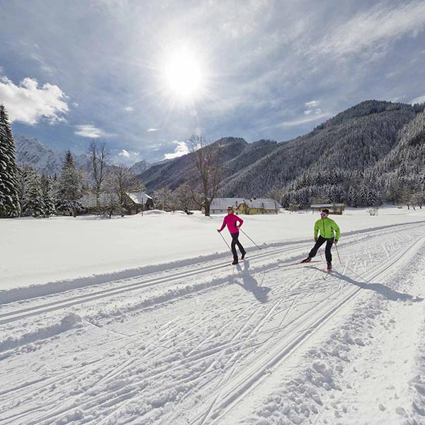 Two cross-country skiers enjoy the wonderfully prepared cross-country trail