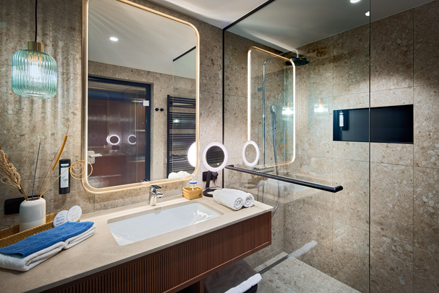 New bathroom with washbasin and shower in beige tones