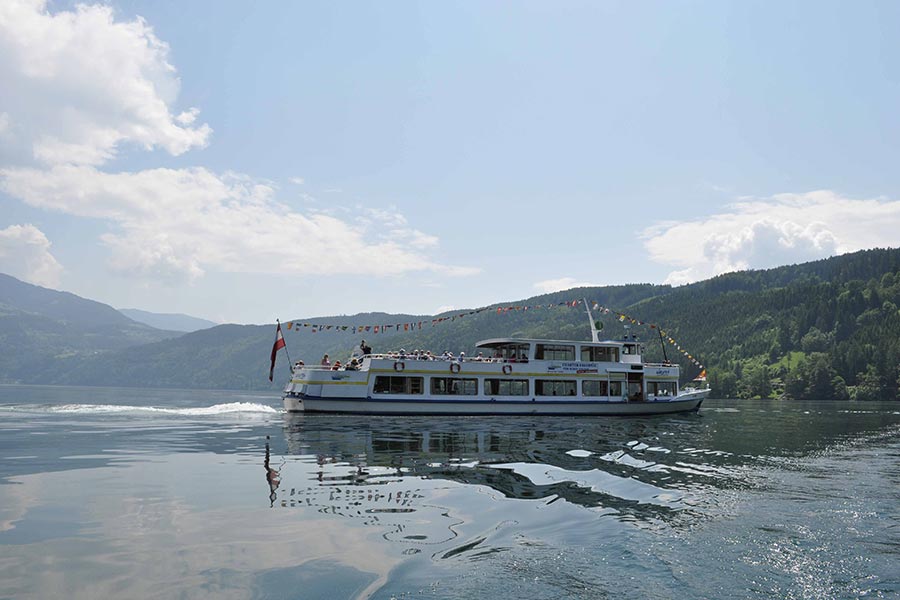 A big boat in the middle of a lake.