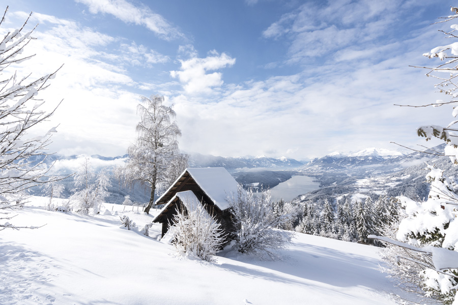 The snowy nature with a view to the Lake Millstatt