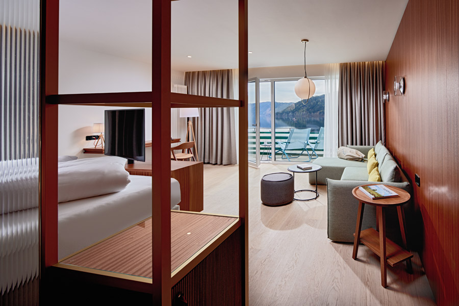 View into the bedroom with balcony and sofa